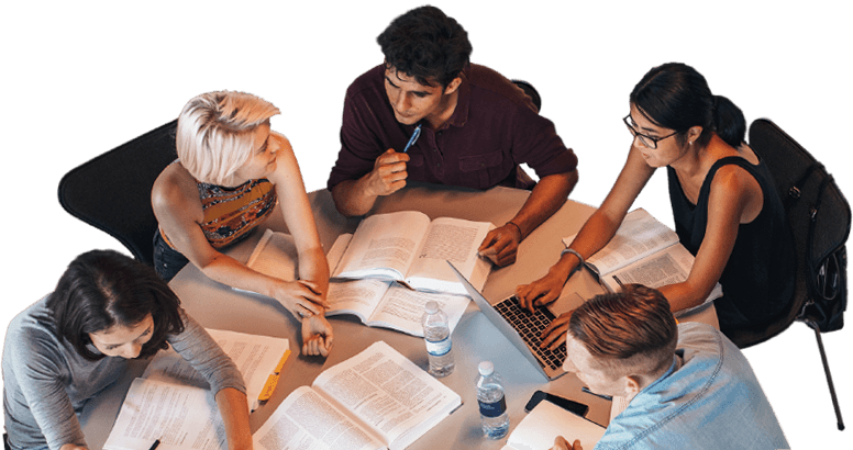 Five International Business degree students sitting around a table with international business textbooks