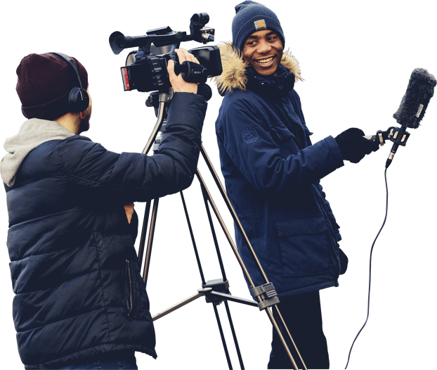 Two Journalism degree students with filming and audio equipment
